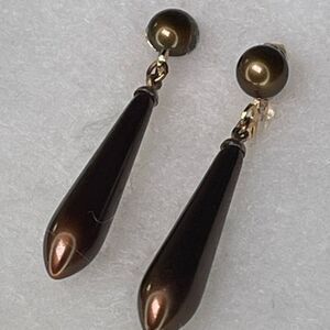 Vintage dangle drop torpedo shaped bronze earrings. Midcentury clip style